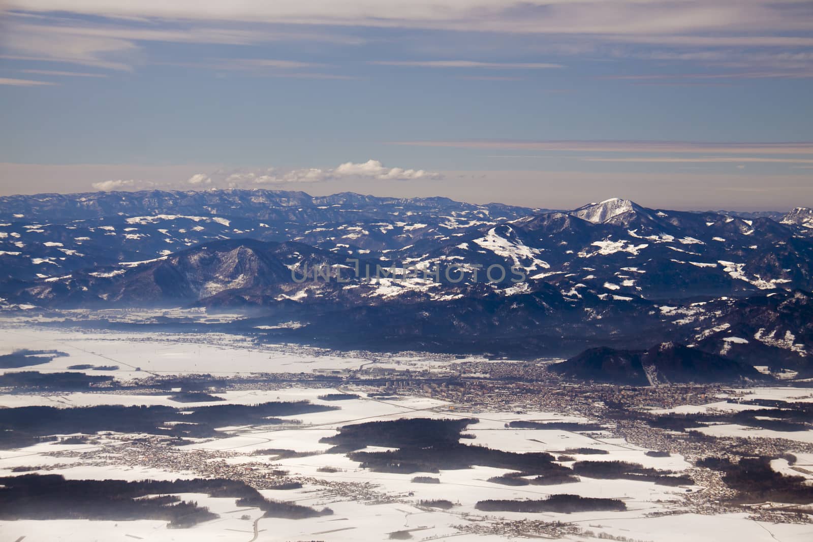 Mountains in a winter and a city (Alps and city Kranj, Slovenia)