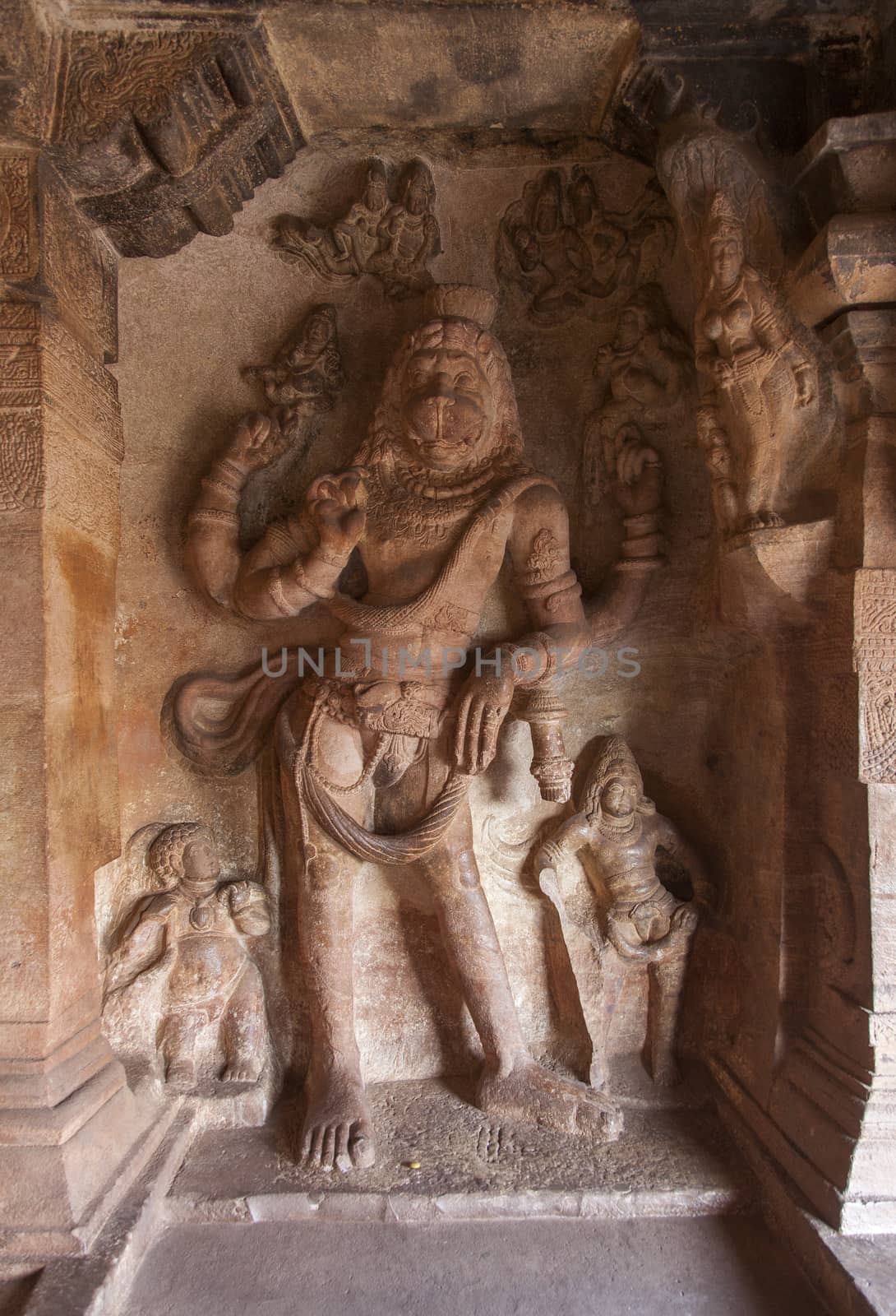 Cave temple cut out from the rock at Badami, India - relief cave entrance in black and white