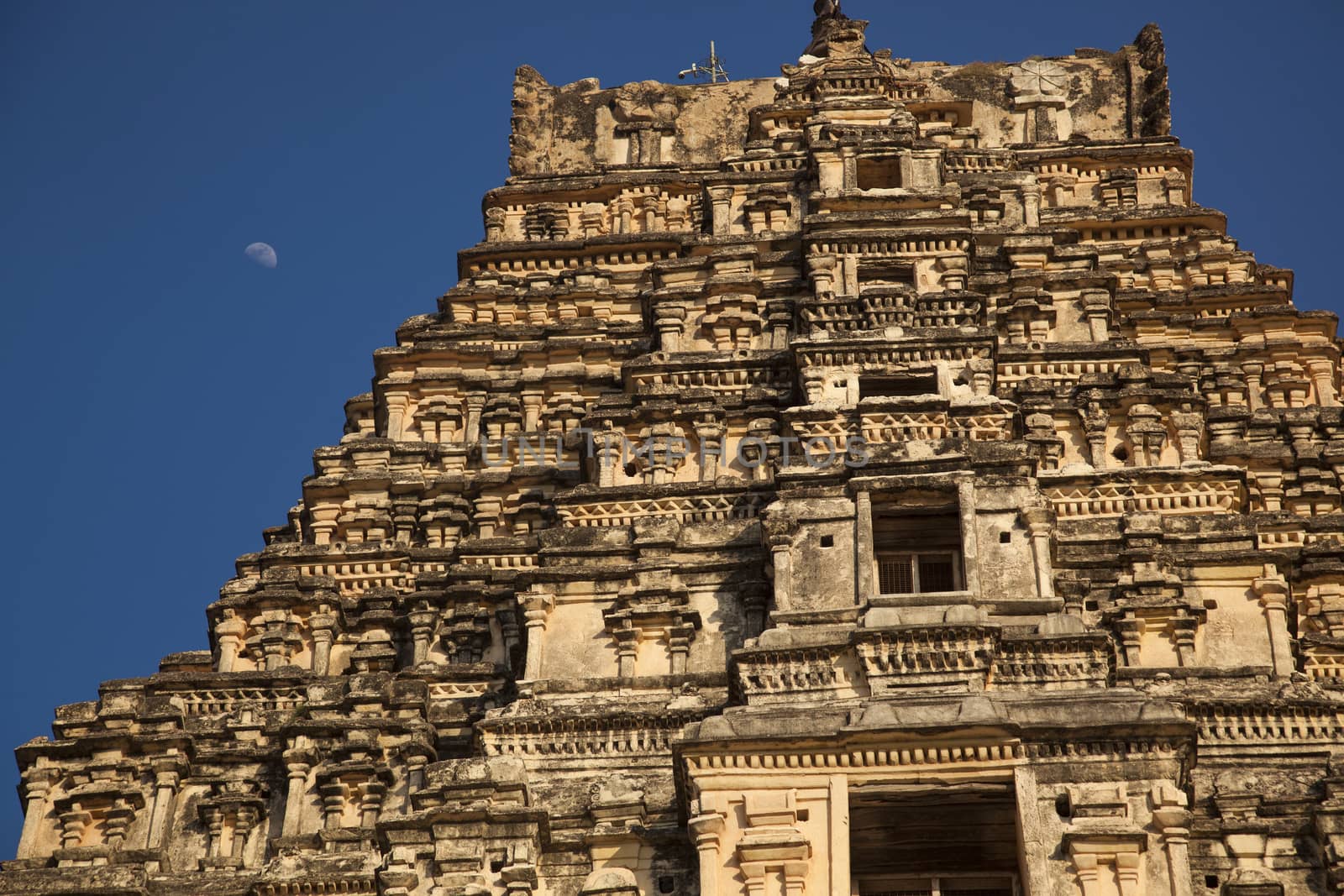 Virupaksha - Vijayanagar Temple - one of the highlight of the Hampi temple complex in India, with moon in the back