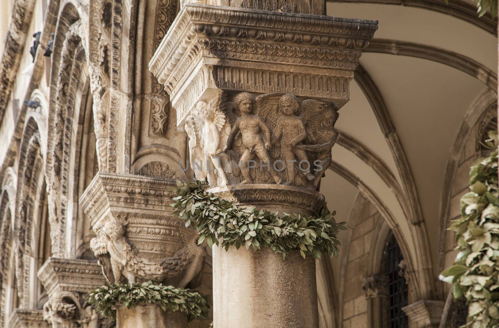 Pillars in Dubrovnik decorated with wreaths.