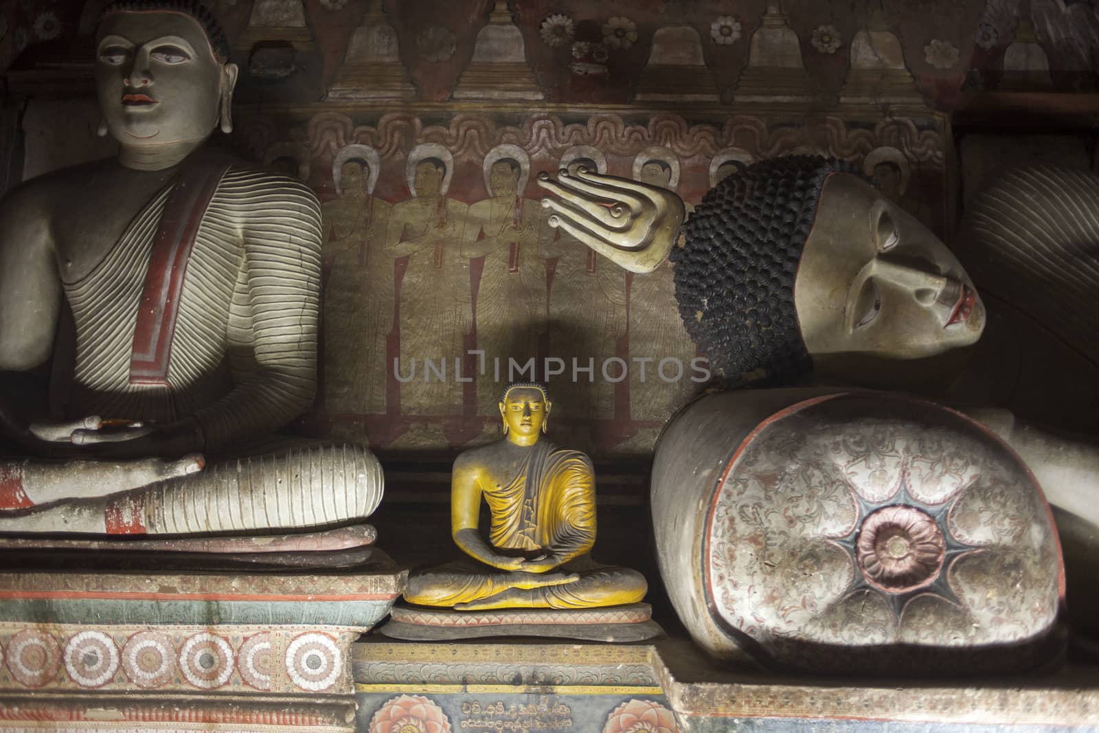 Group of statues inside Dambula cave temple in Sri Lanka. Indoors.