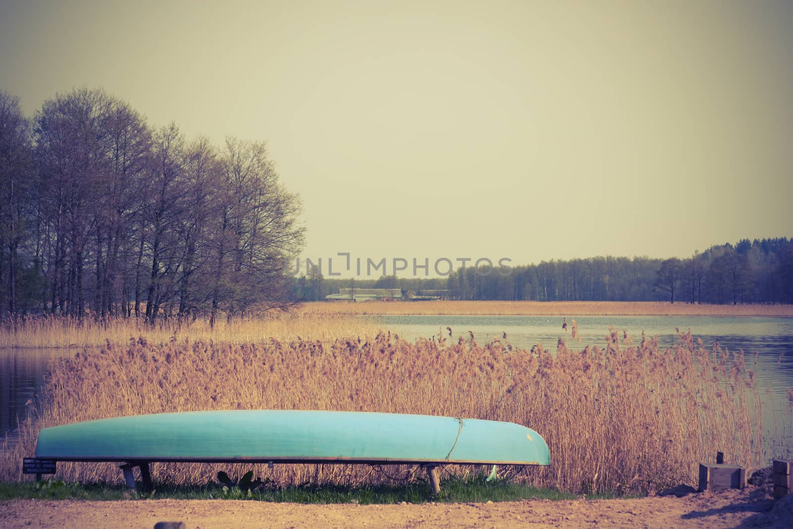 Boat near the lake the lake (cross processed)