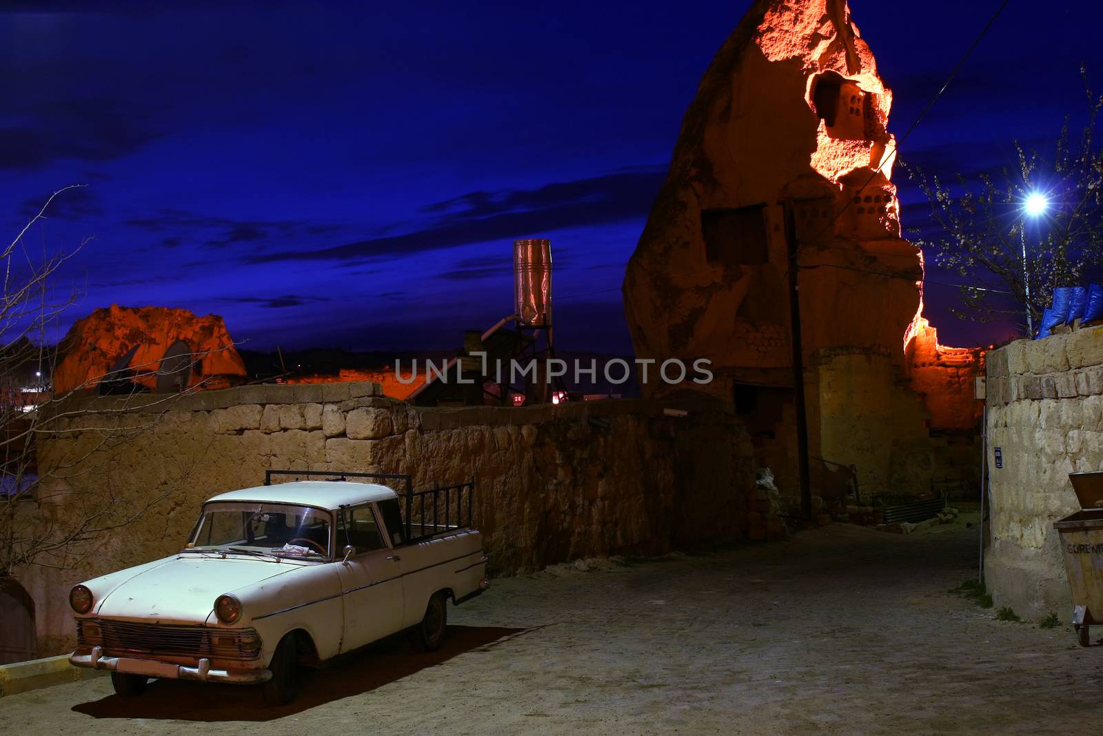 Old car in wonderful land of Cappadokia in Turkey with amaizing sky
