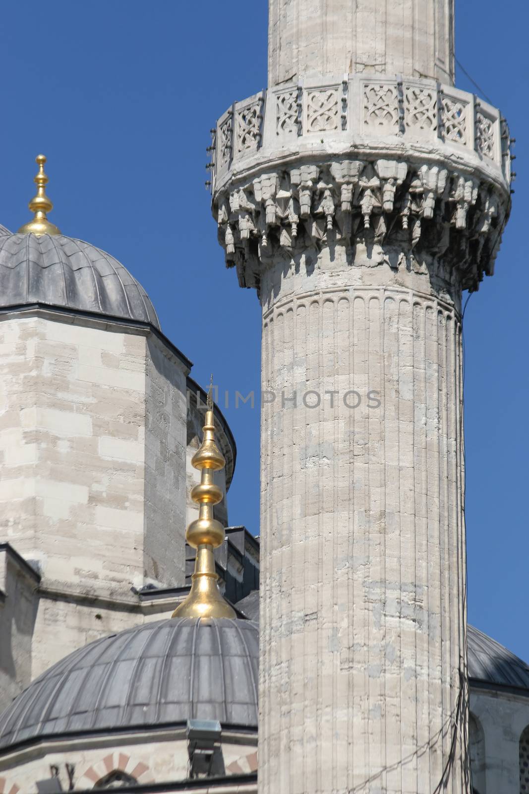 Detail on a mosque's dome and minaret