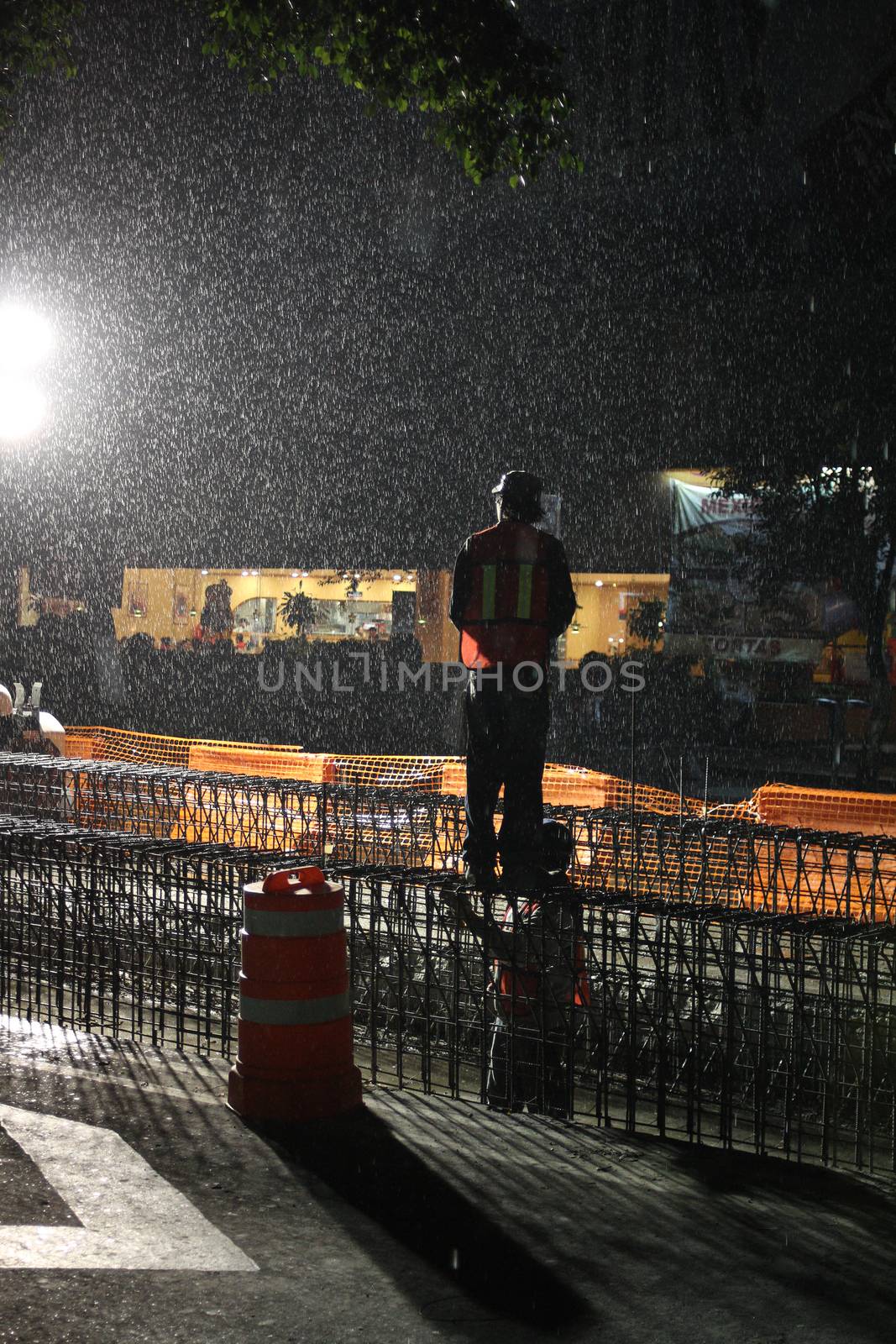 Construction worker making a road in tough condition