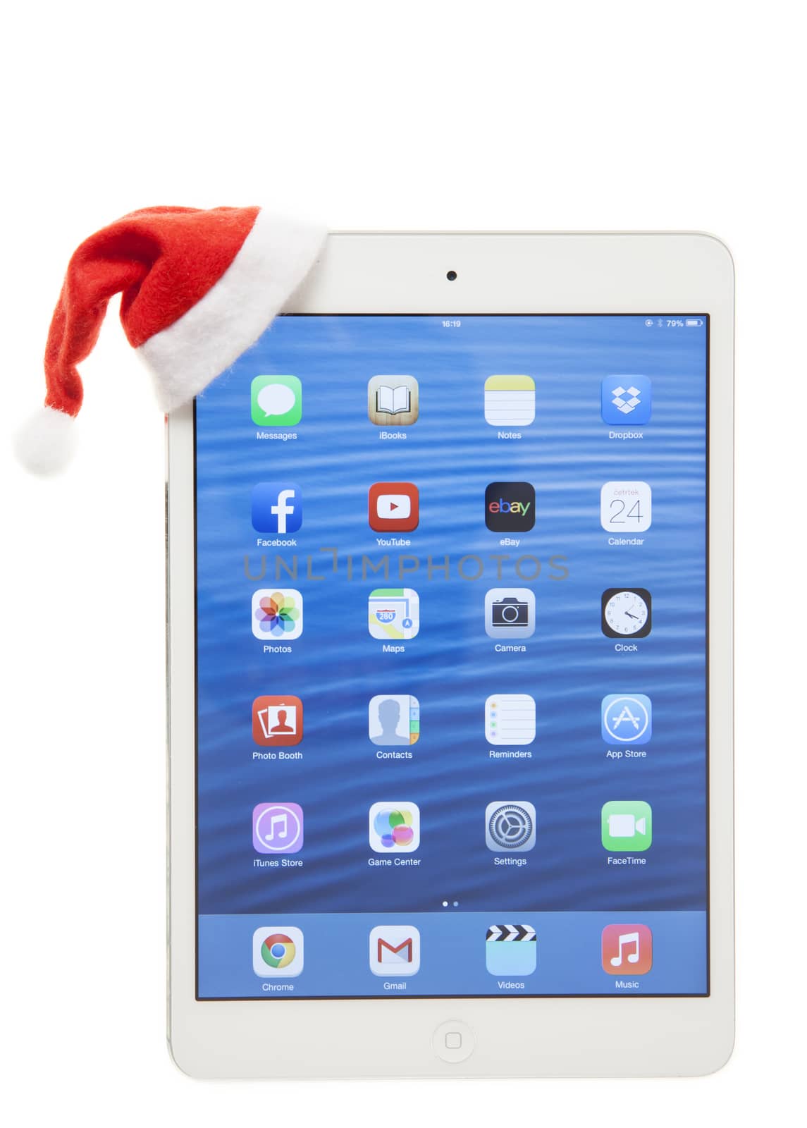 Apple iPad Mini with santa hat. Isolated on white background.