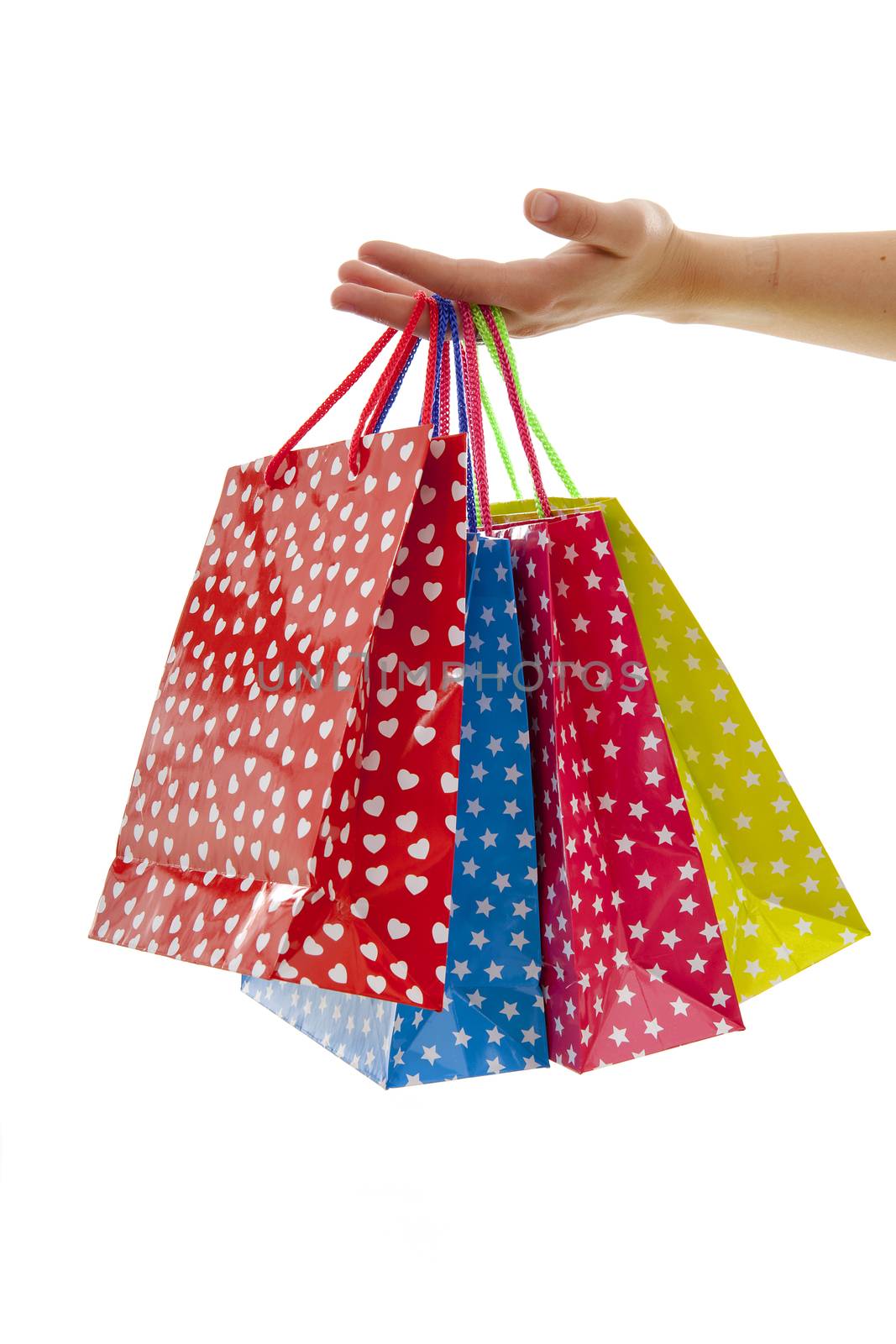 Hand is holding colorful shopping bags by sannie32