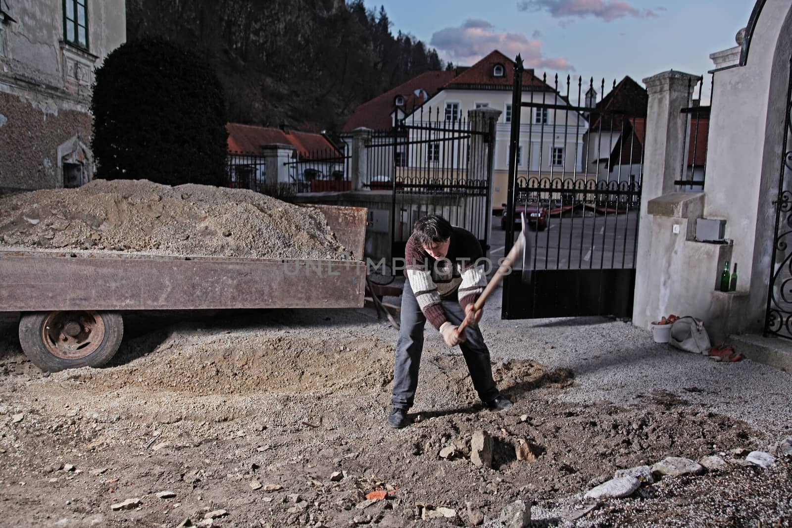 Man working in his courtyard