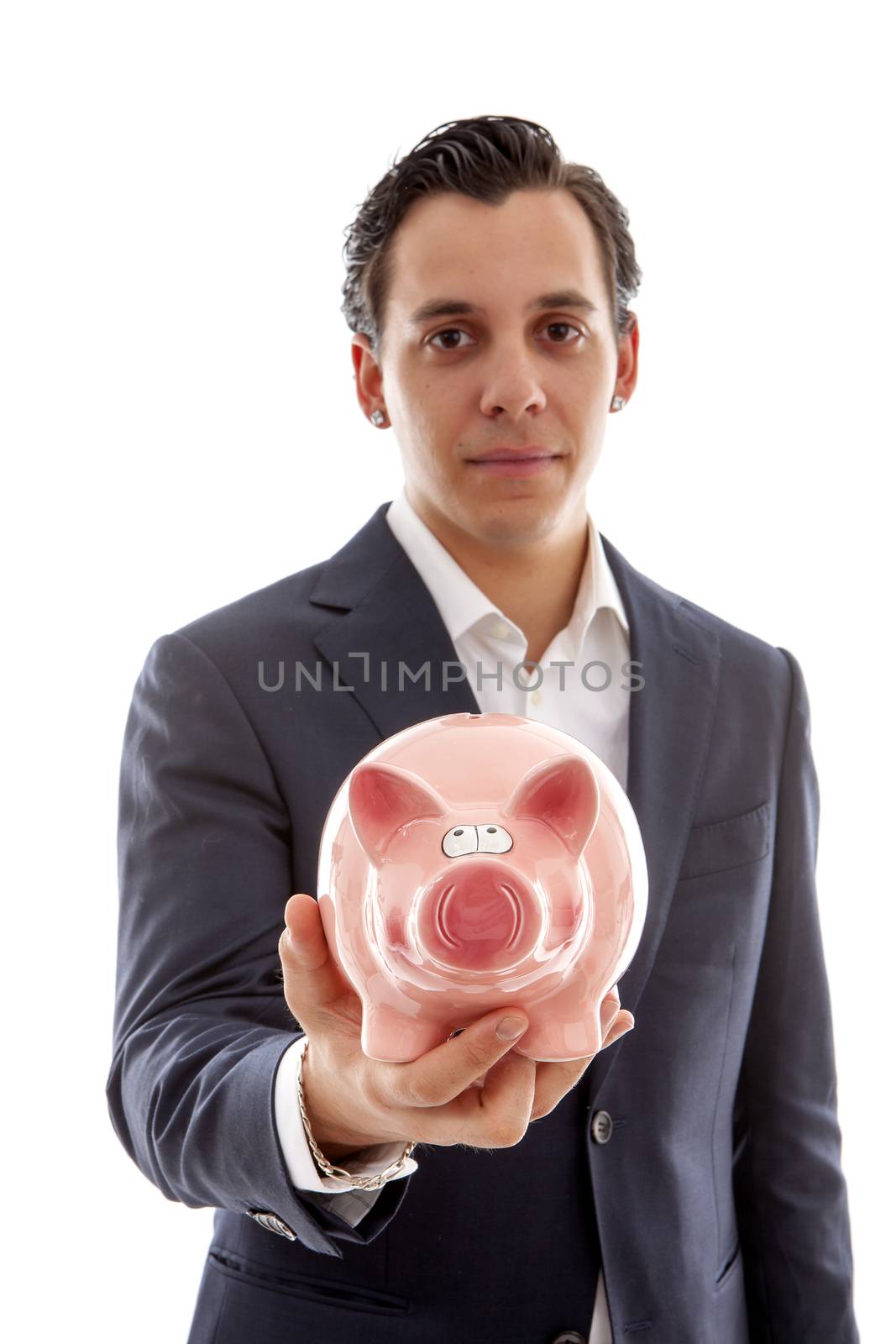 Businessman is holding piggy bank over white background