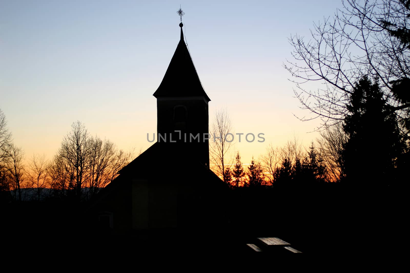 Silhouette of a church at sunset