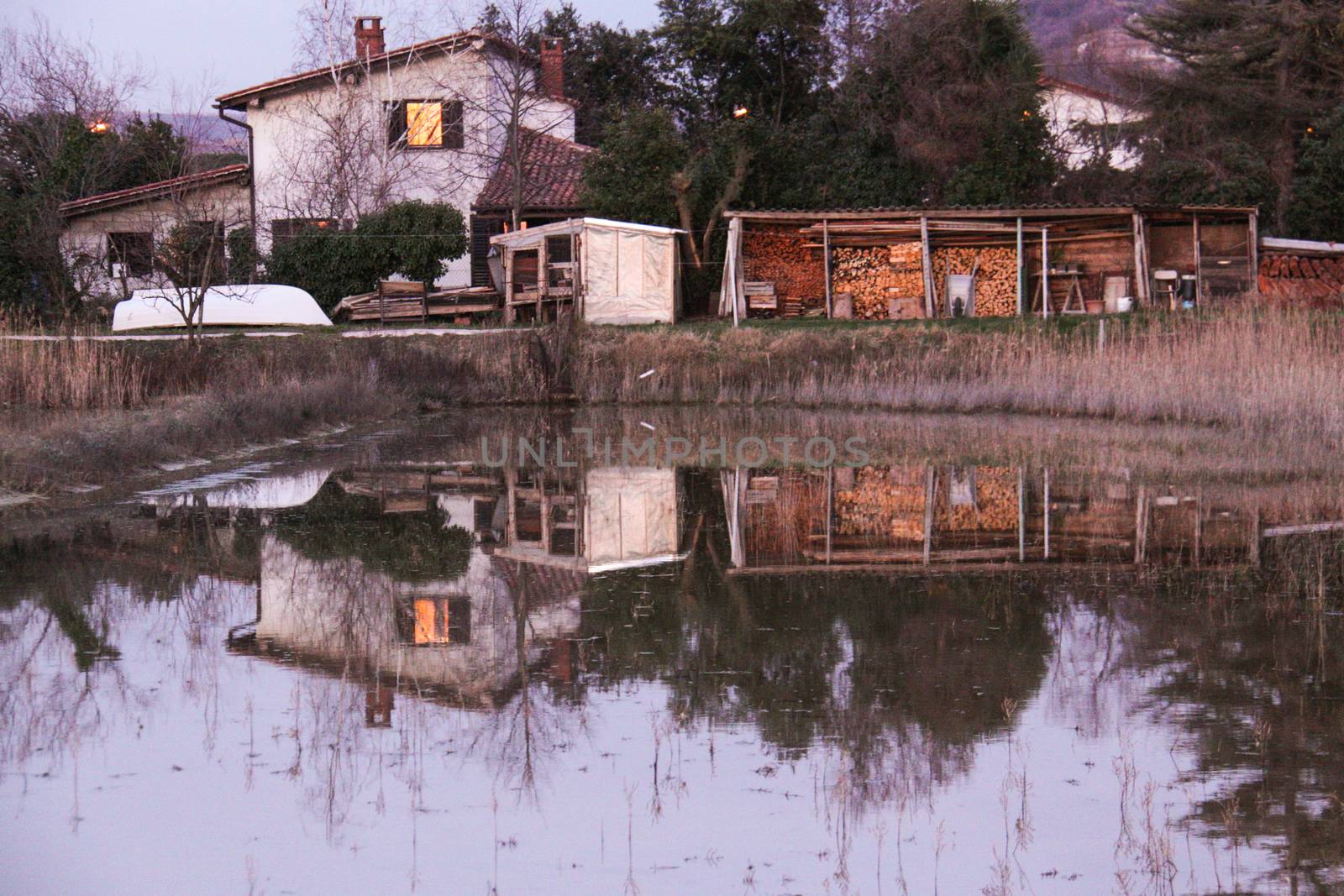 Saltpans with a house in the back (in Strunjan/Piran, Slovenia)