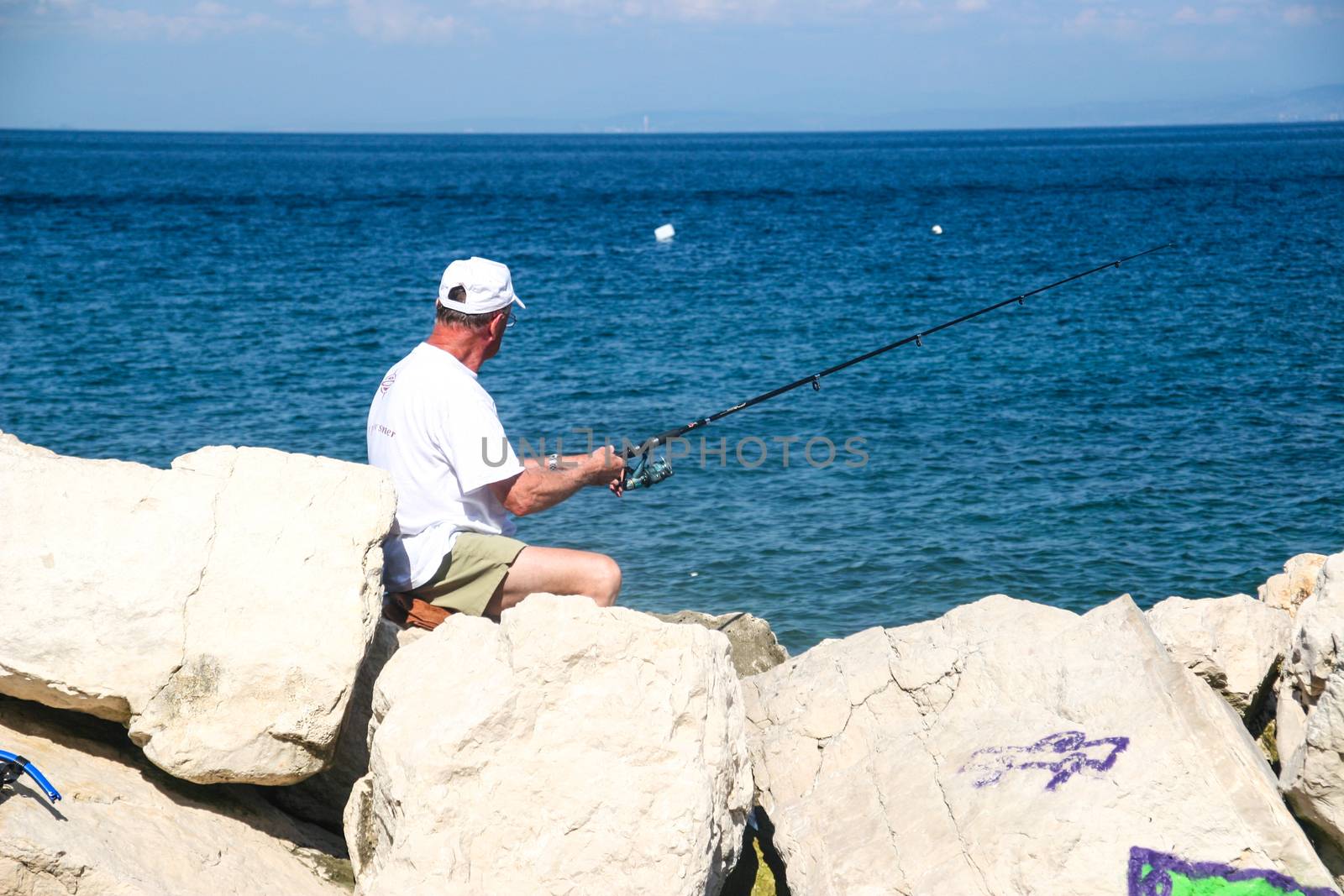 Fisherman in coastal town of Piran in Slovenia