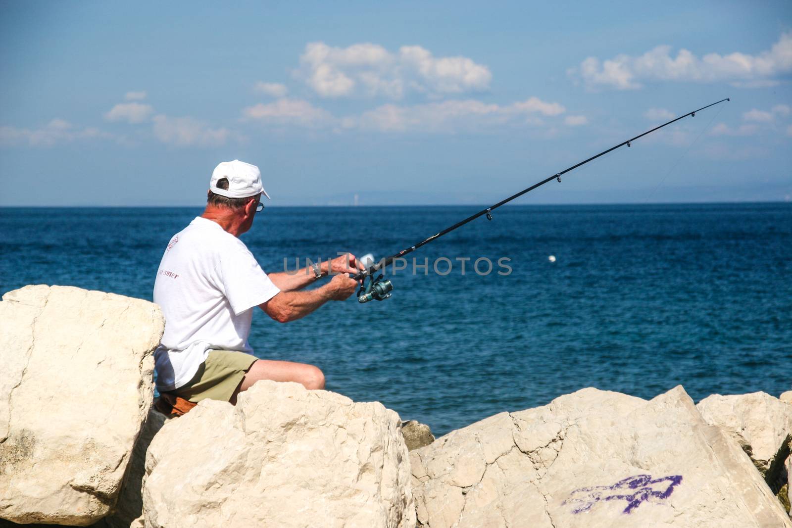 Fisherman in coastal town of Piran in Slovenia