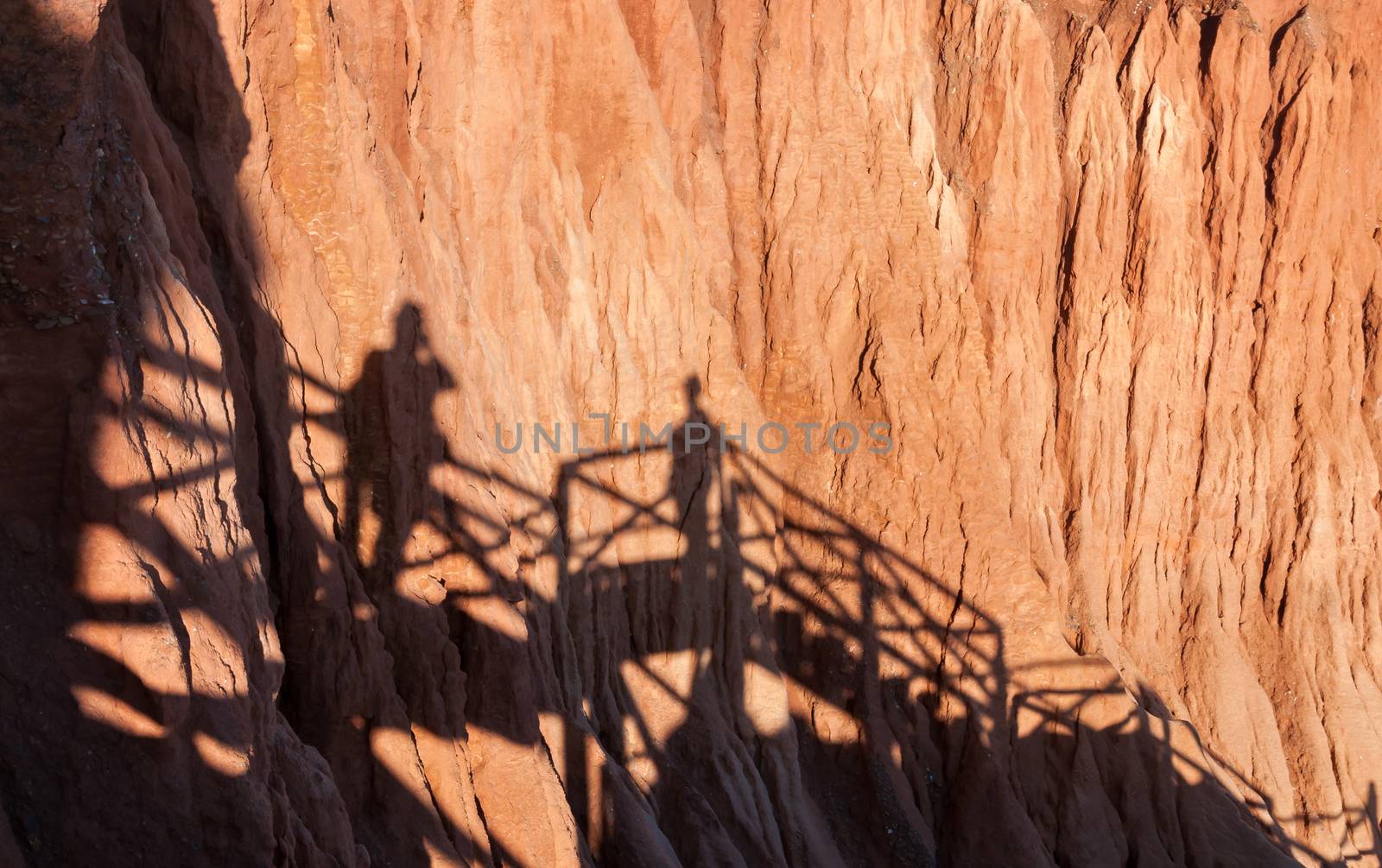 Shadows of people taking pictures on the cliffs