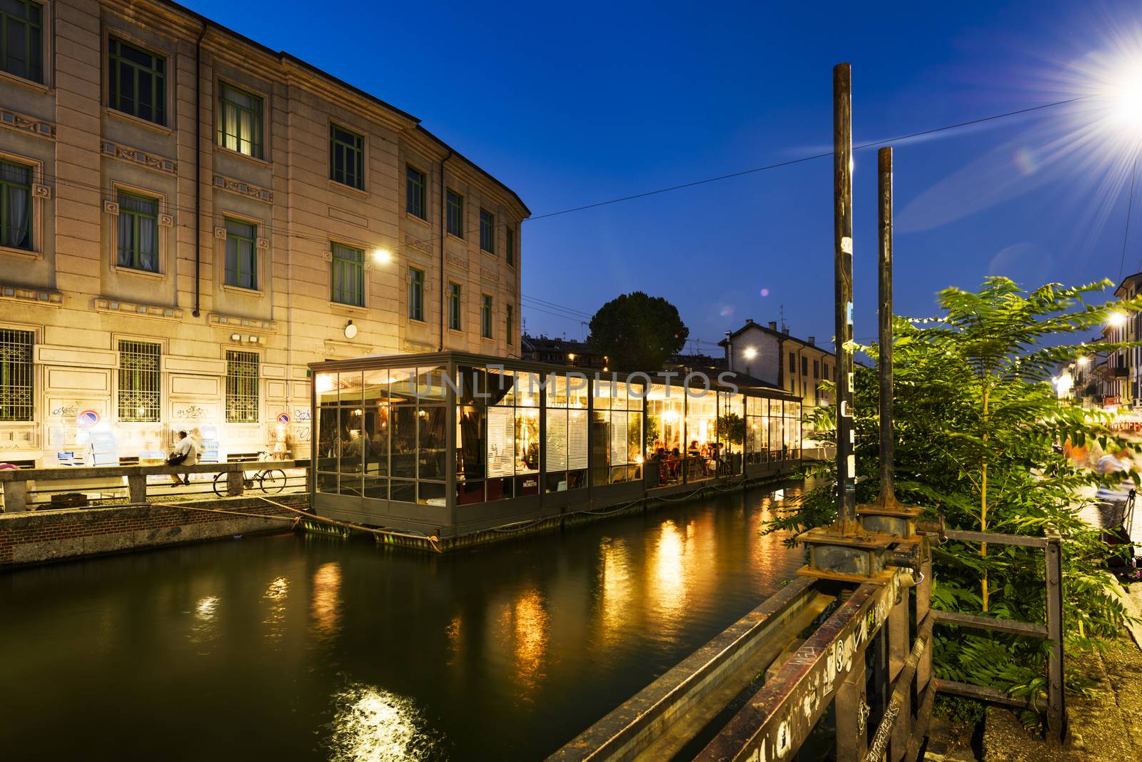 MILAN , LOMBARDIE,  ITALY - AUGUST 29 2015 : The Naviglio Grande canal at the evening in Milan, Italy