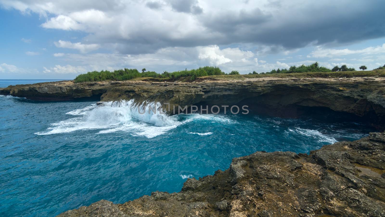 Waves on the rocks near the island of Lembongan near Bali, Indonesia