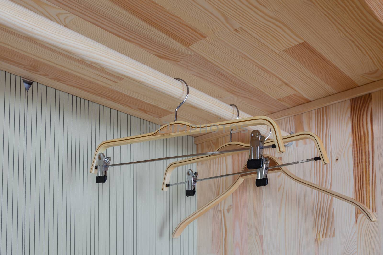 Empty wooden wardrobe and cloth hanging