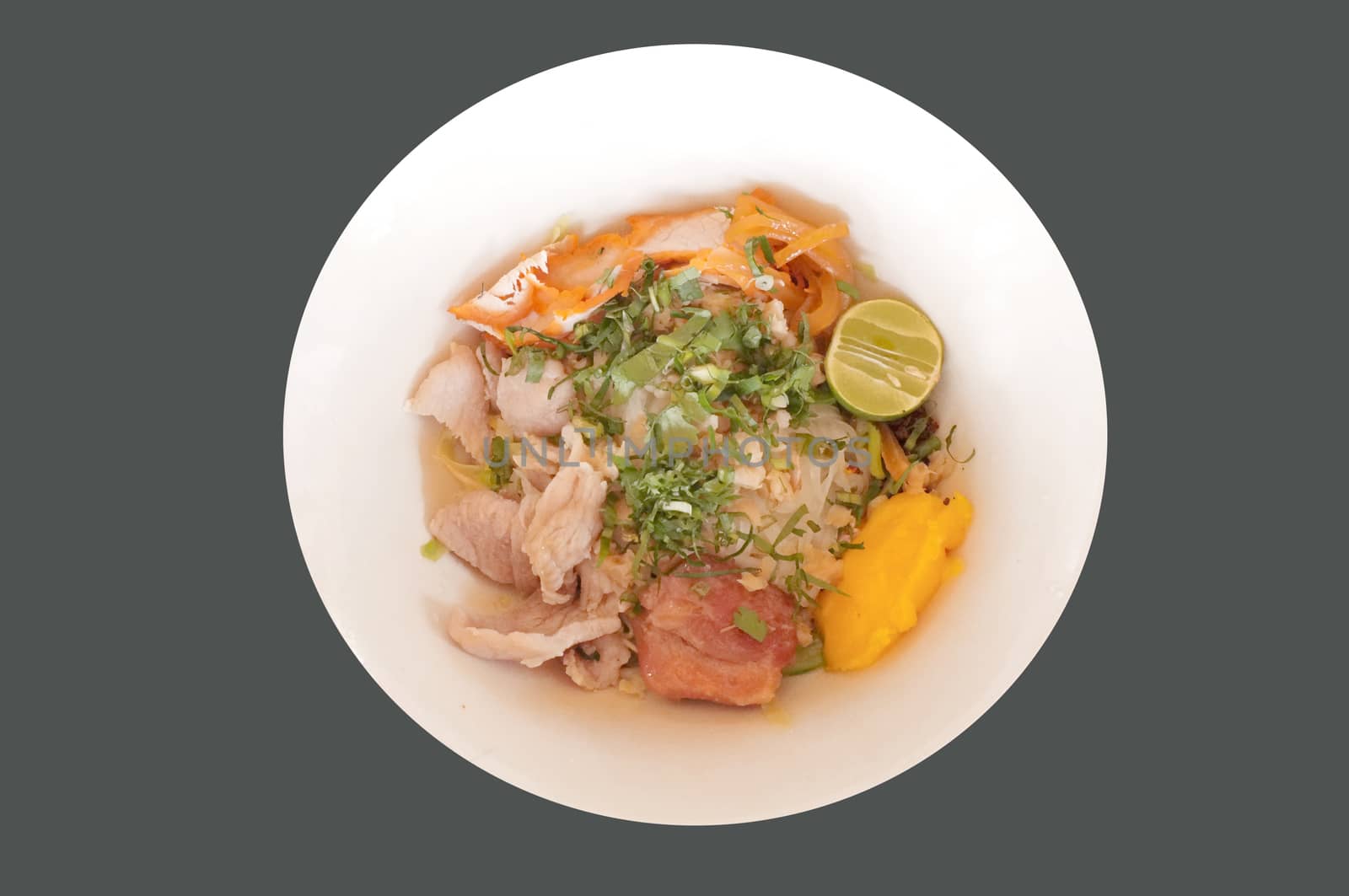 Delicious rice noodles with pork close-up on a plate