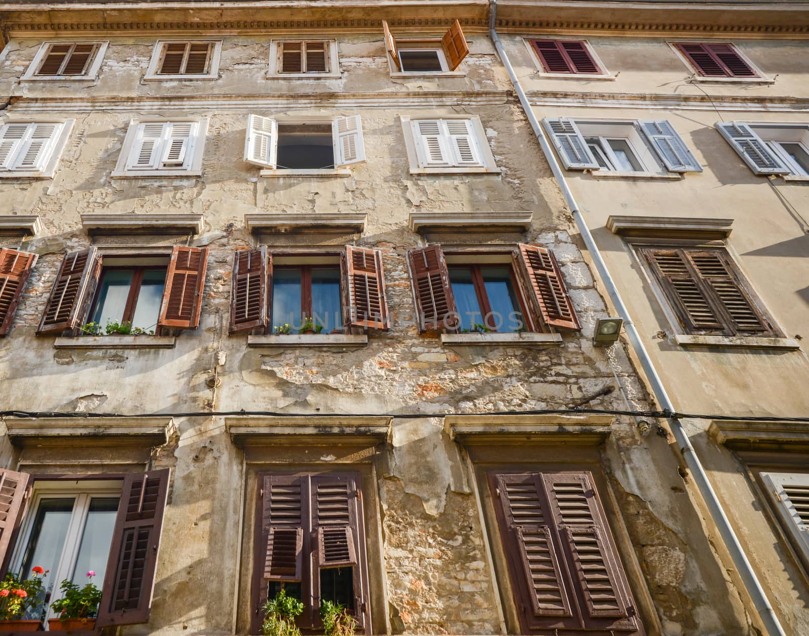 Windows and walls in old town Rovinj Croatia by vlaru