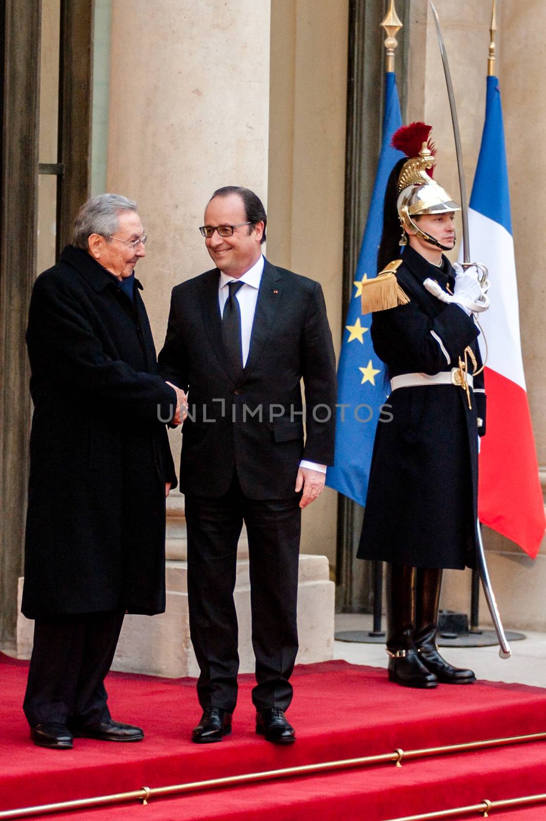 FRANCE, Paris: French President Francois Hollande (R) welcomes Cuban President Raul Castro upon his arrival on February 1, 2016 at the Elysee Presidential Palace in Paris.