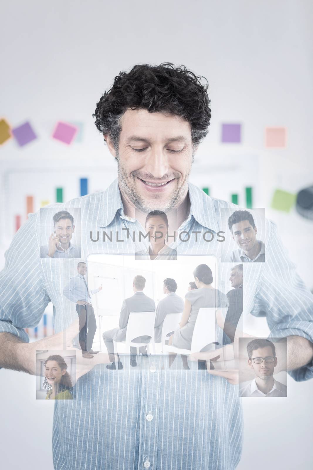 Business people having a meeting  against businessman showing digital tablet in creative office