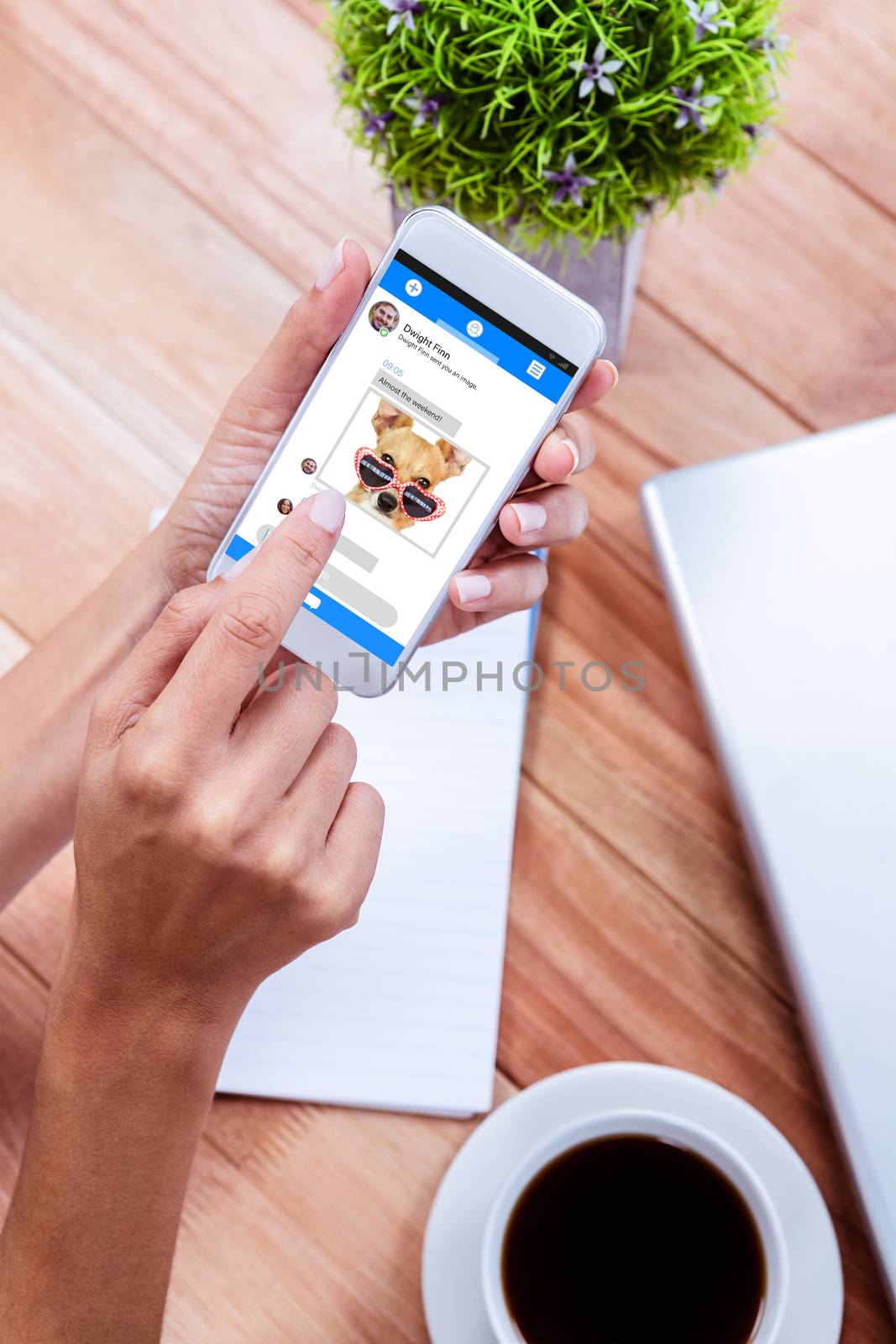 Smartphone chat against overhead of feminine hands using smartphone