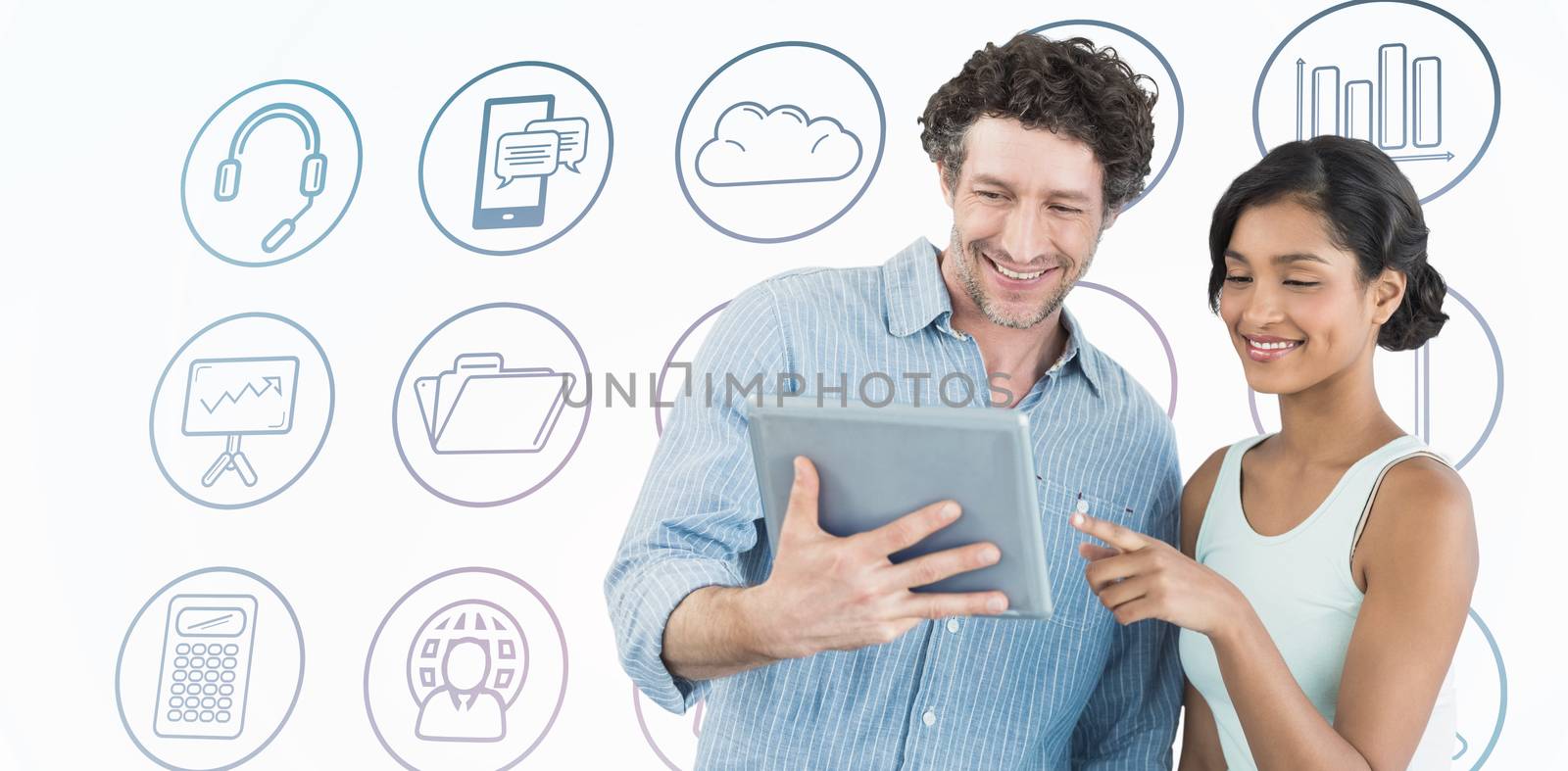 Composite image of smiling business people using digital tablet by Wavebreakmedia