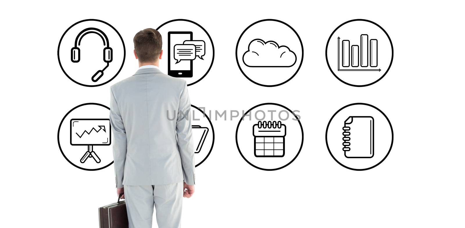 Businessman holding his briefcase against telephone apps icons 