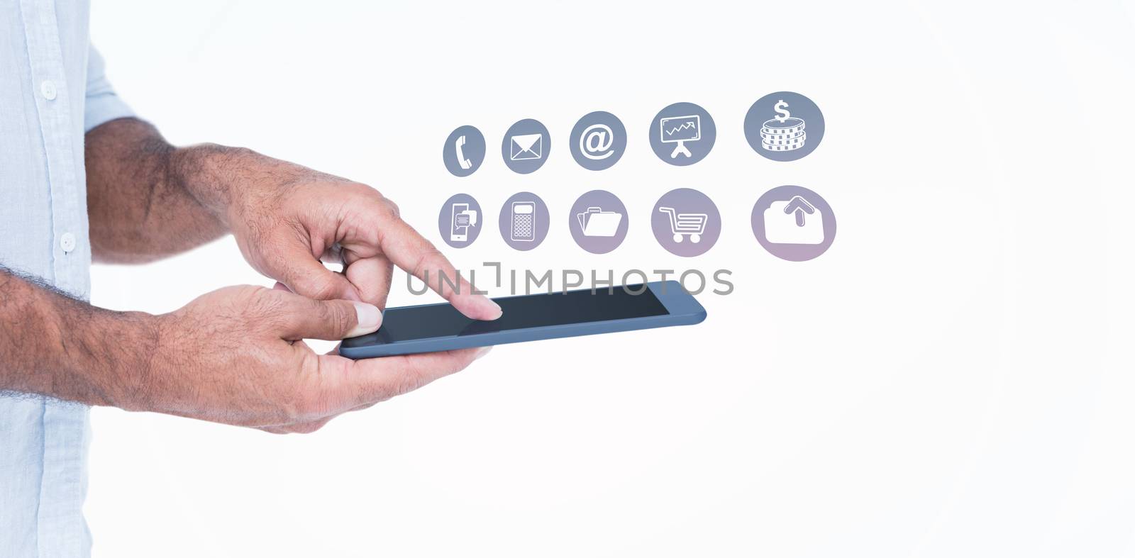 A man using tablet computer  against telephone apps icons 