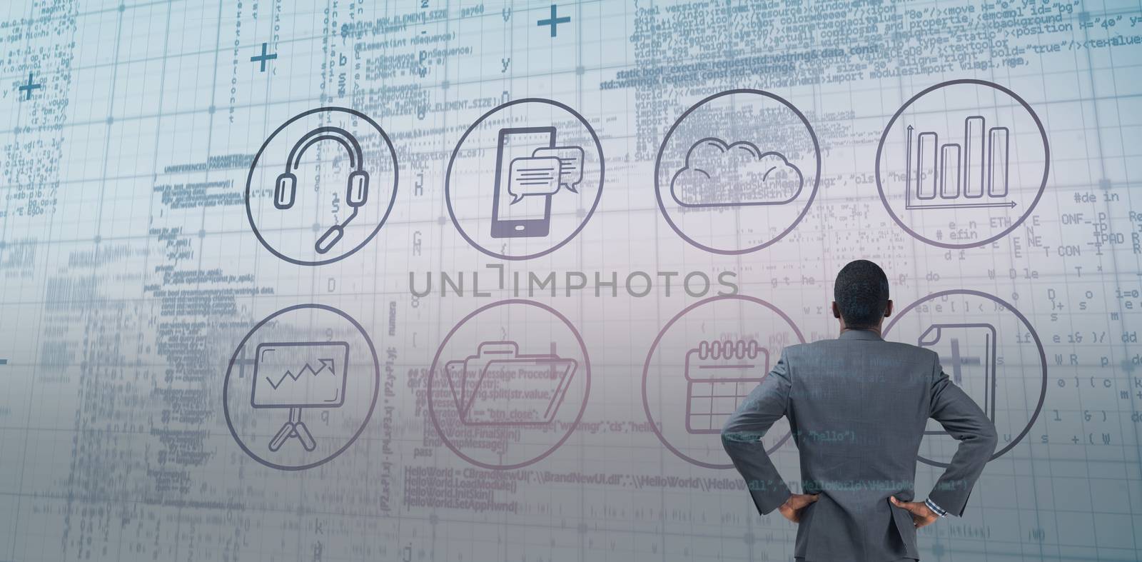Composite image of businessman standing with hands on hips by Wavebreakmedia