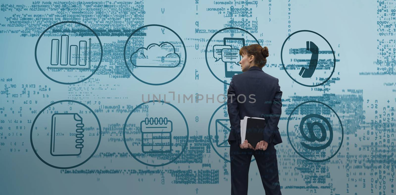 Businesswoman looking against blue data