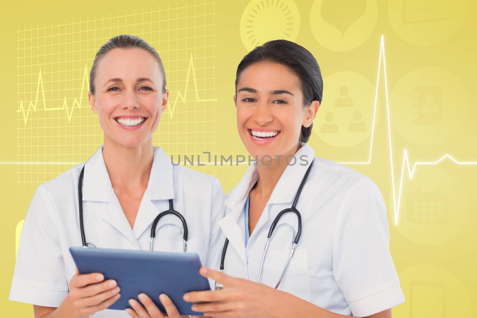 Nurses with tablet pc against medical background with ecg line in yellow