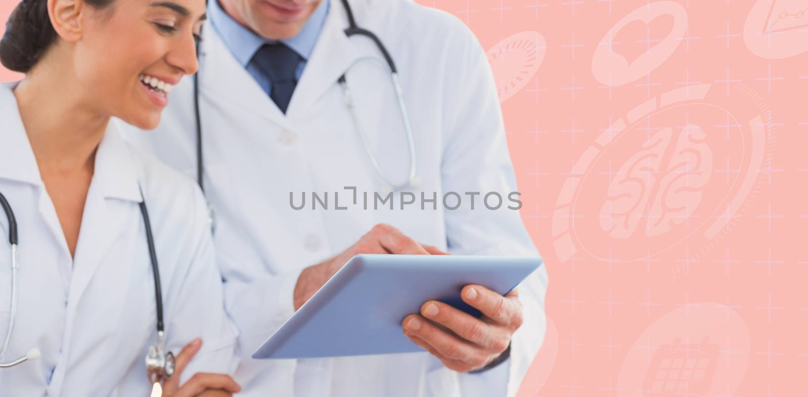 Composite image of happy doctors looking at clipboard by Wavebreakmedia