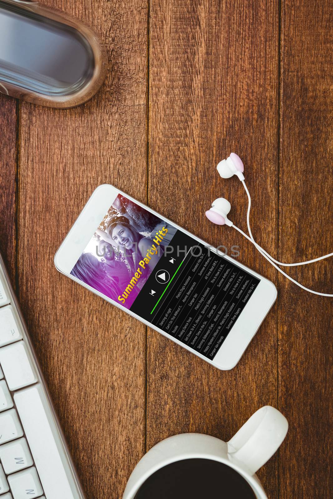 Music app against white smartphone with cup of coffee