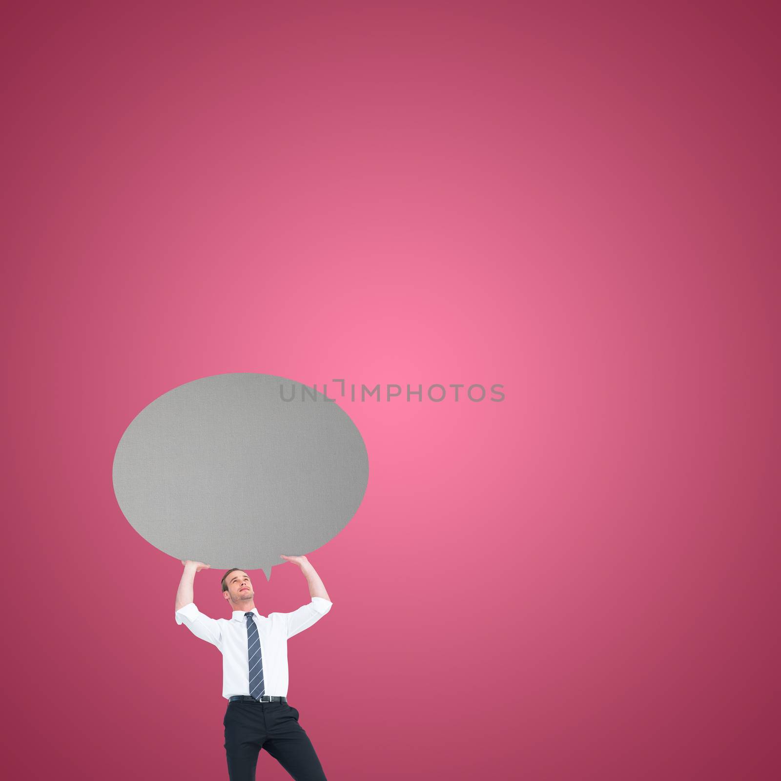 Businessman holding a speech bubble against red vignette