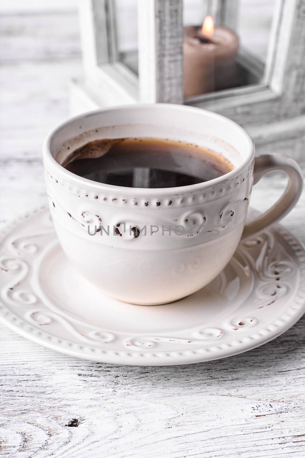 Light set with light coffee on wooden background