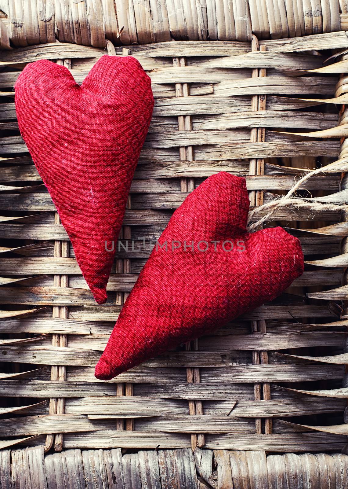 Handmade heart fabric Valentine's day on wooden table.