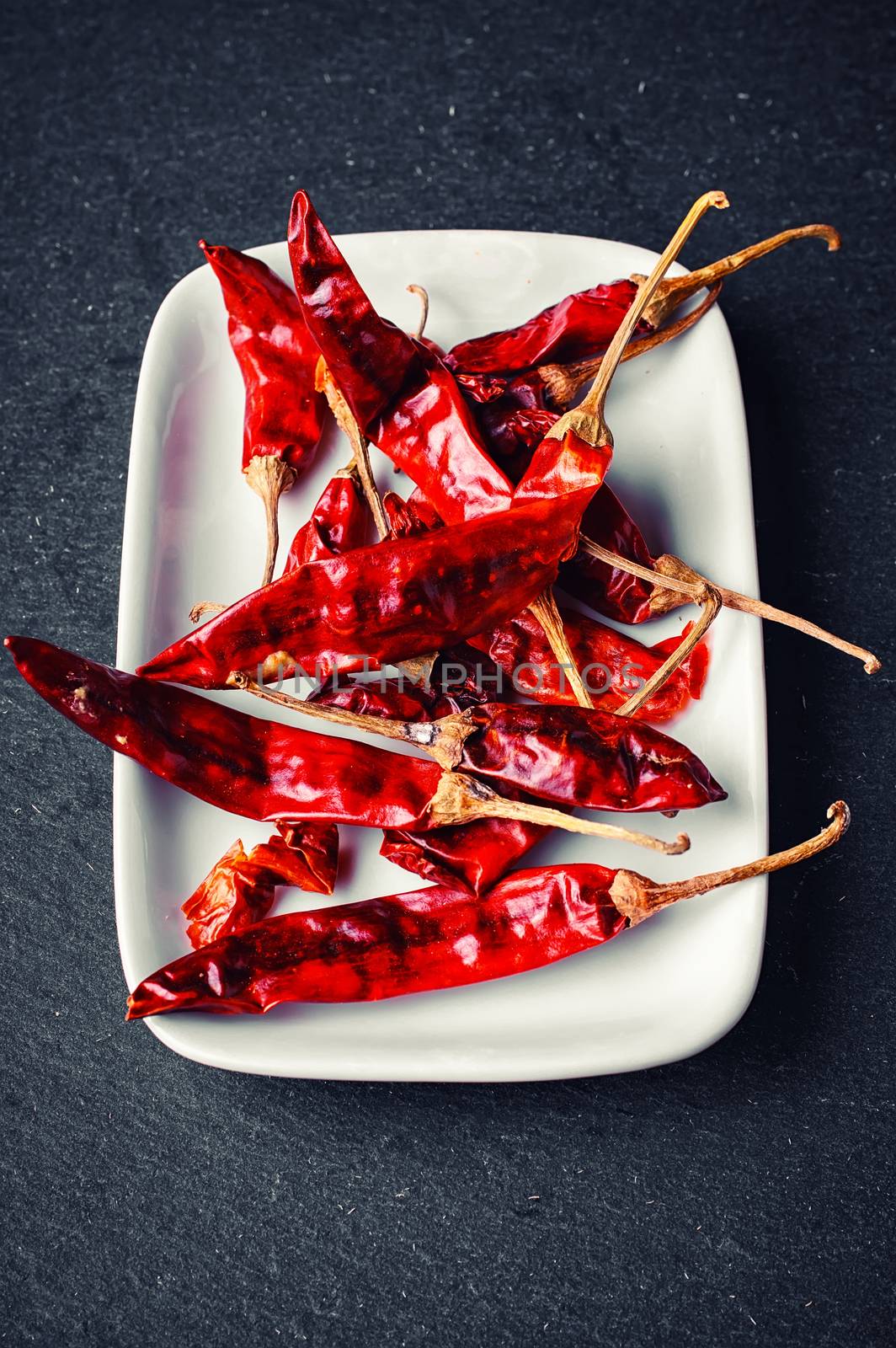 Assembly seasoning of pepper and hot spices in a porcelain bowl