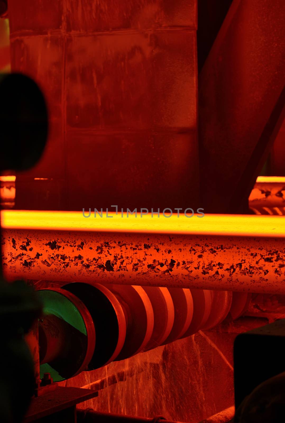 hot steel on conveyor in steel mill