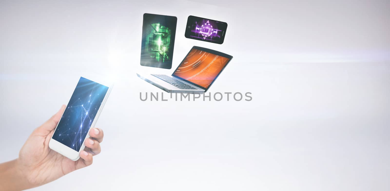 Cropped image of businesswoman holding smart phone against grey background