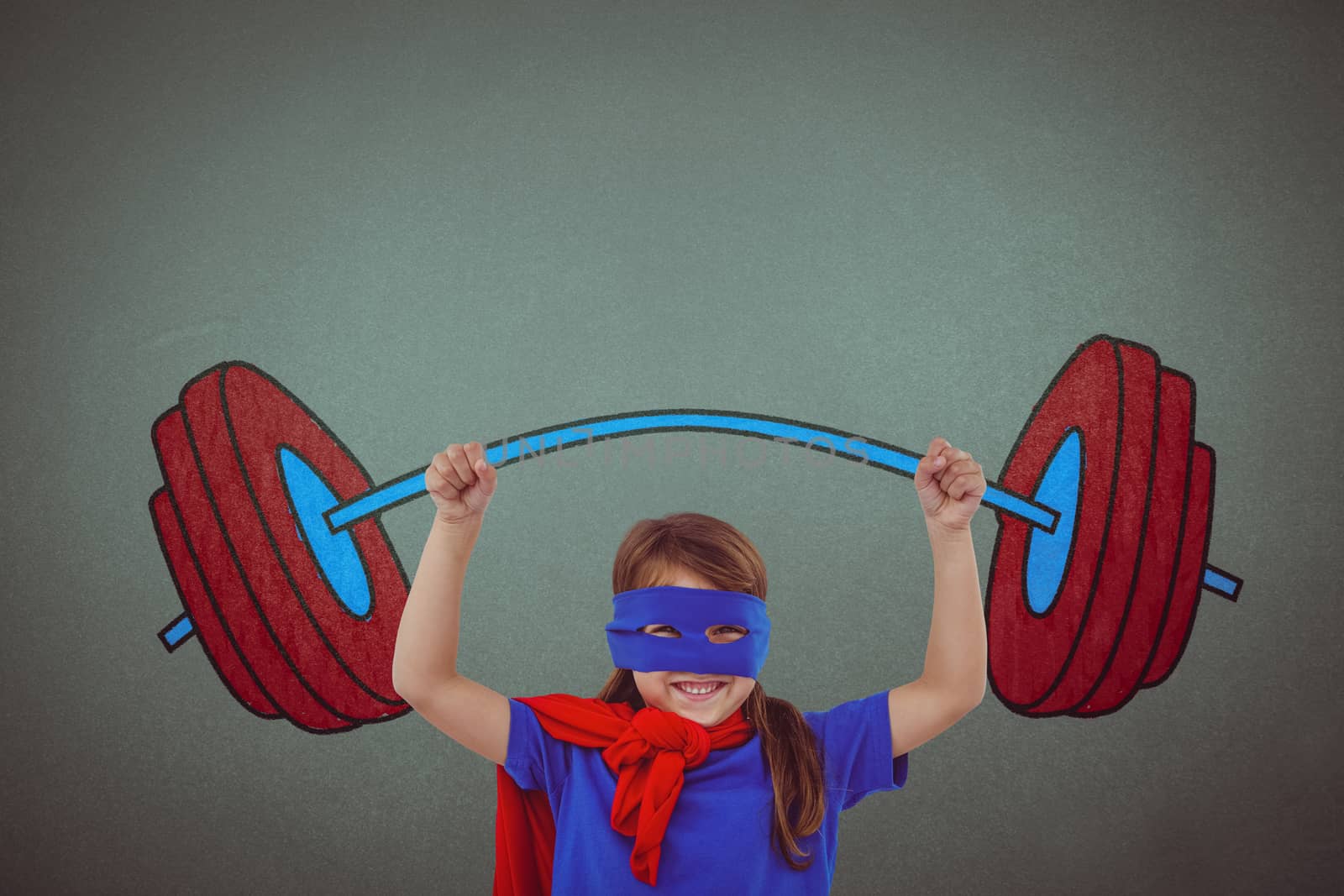 Little girl holding dumbbell against grey