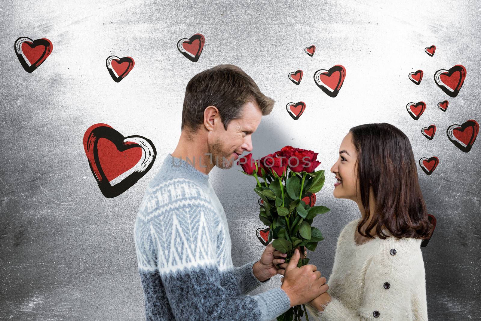 Composite image of romantic couple holding red roses by Wavebreakmedia