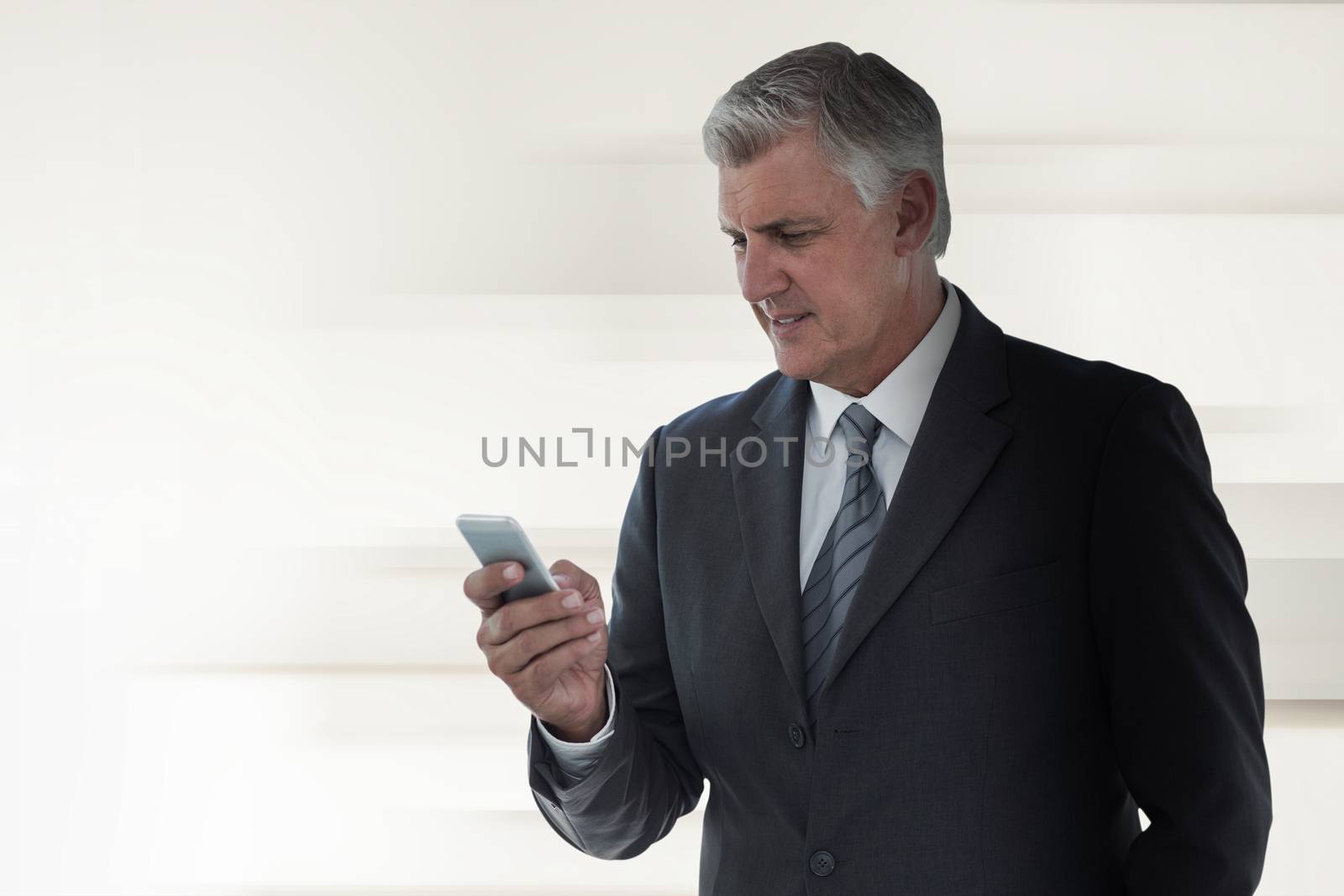 Composite image of businessman using his smartphone by Wavebreakmedia