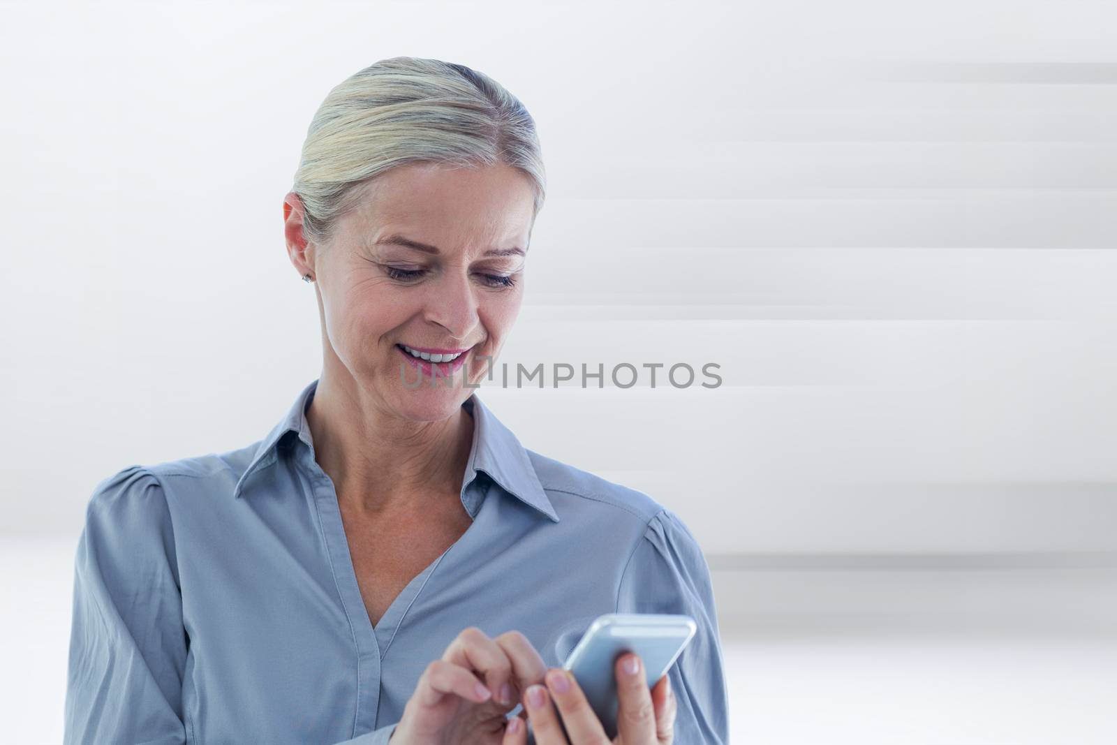 Businesswoman using her smartphone against abstract white design