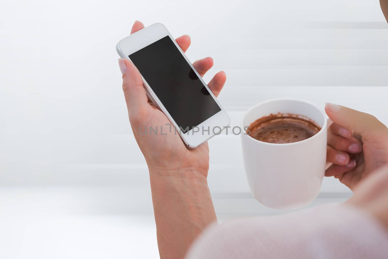 Composite image of woman using her smartphone by Wavebreakmedia