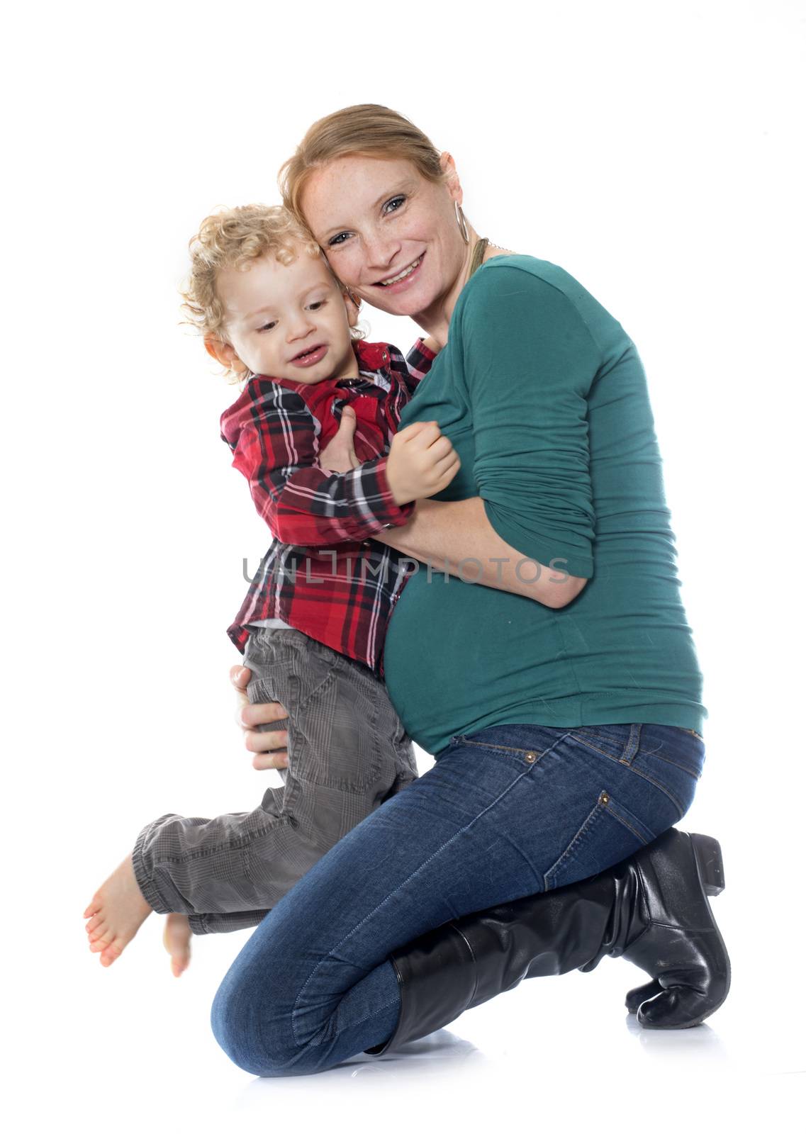 little boy and mother in front of white background