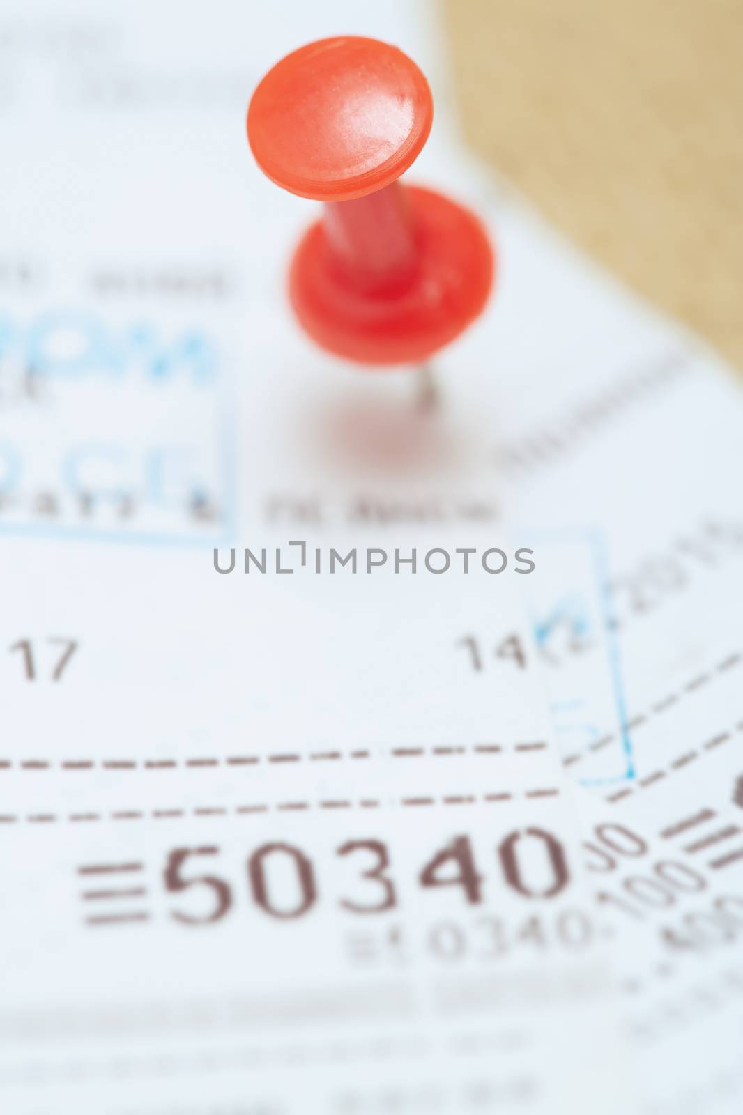 Cash register with pushpin. Close-up photo