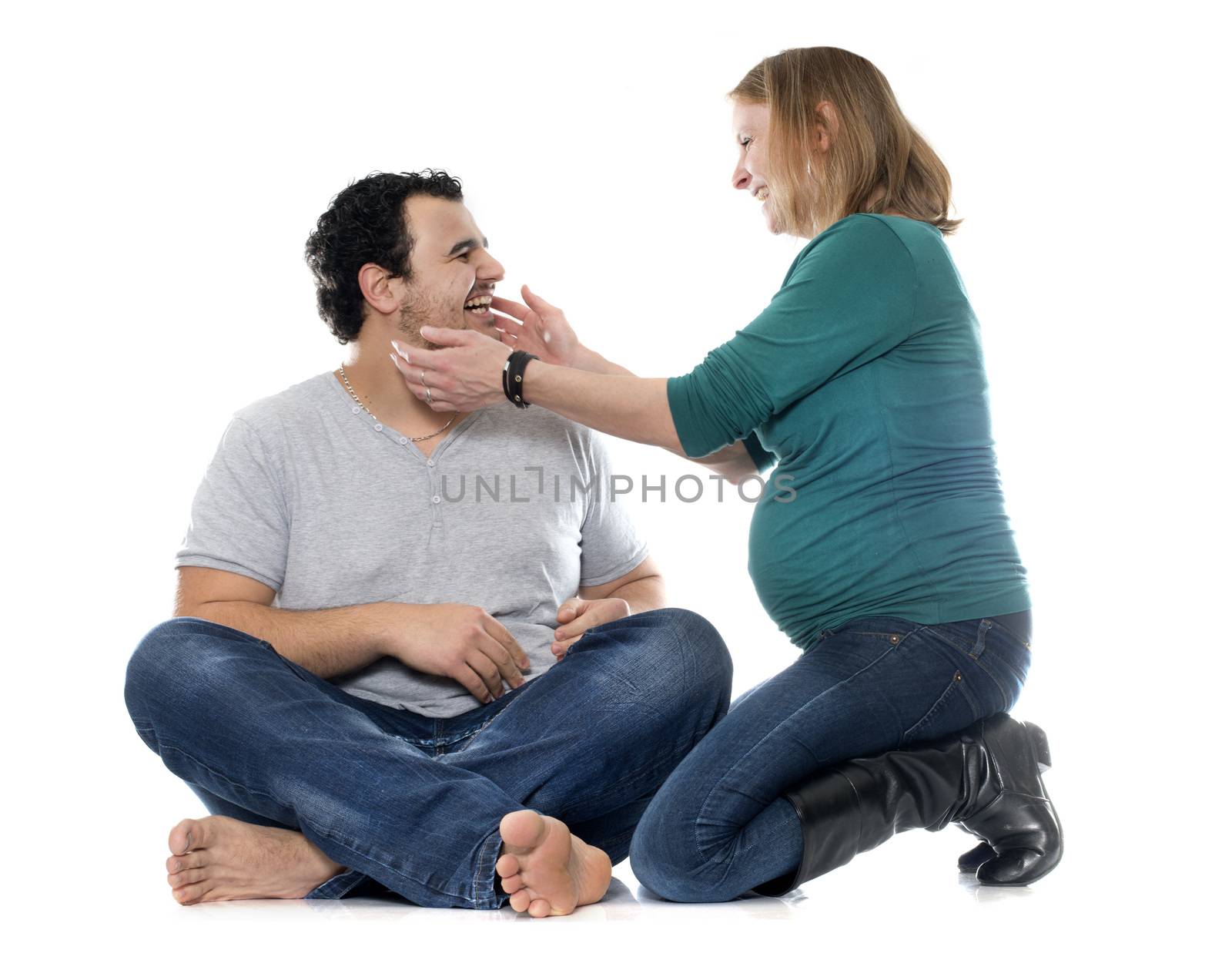 man and pregnant woman in front of white background