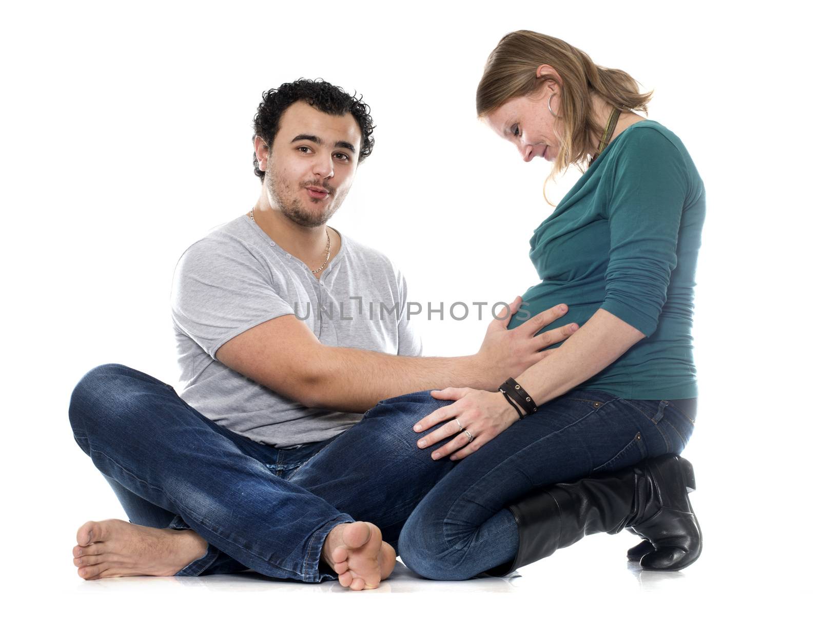 man and pregnant woman in front of white background
