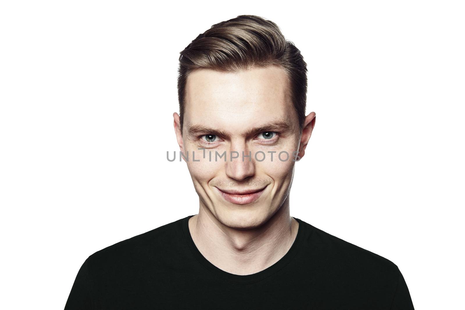 Studio shot of young man smiling to camera. Isolated on white background. Horizontal format, he is looking to the camera, he is wearing a black T-shirt.
